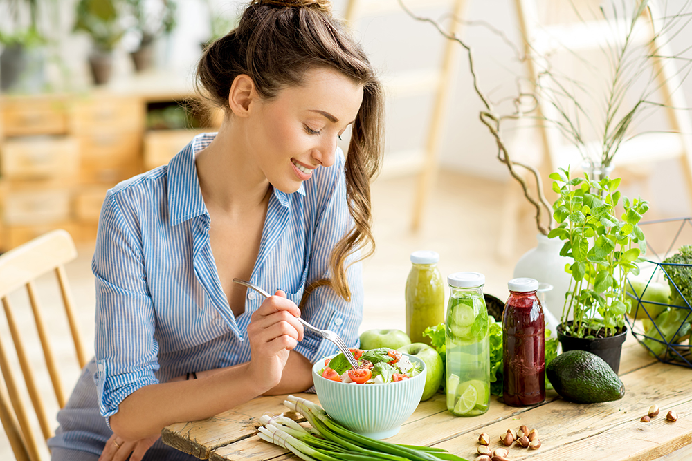 Woman eating healthy salad.