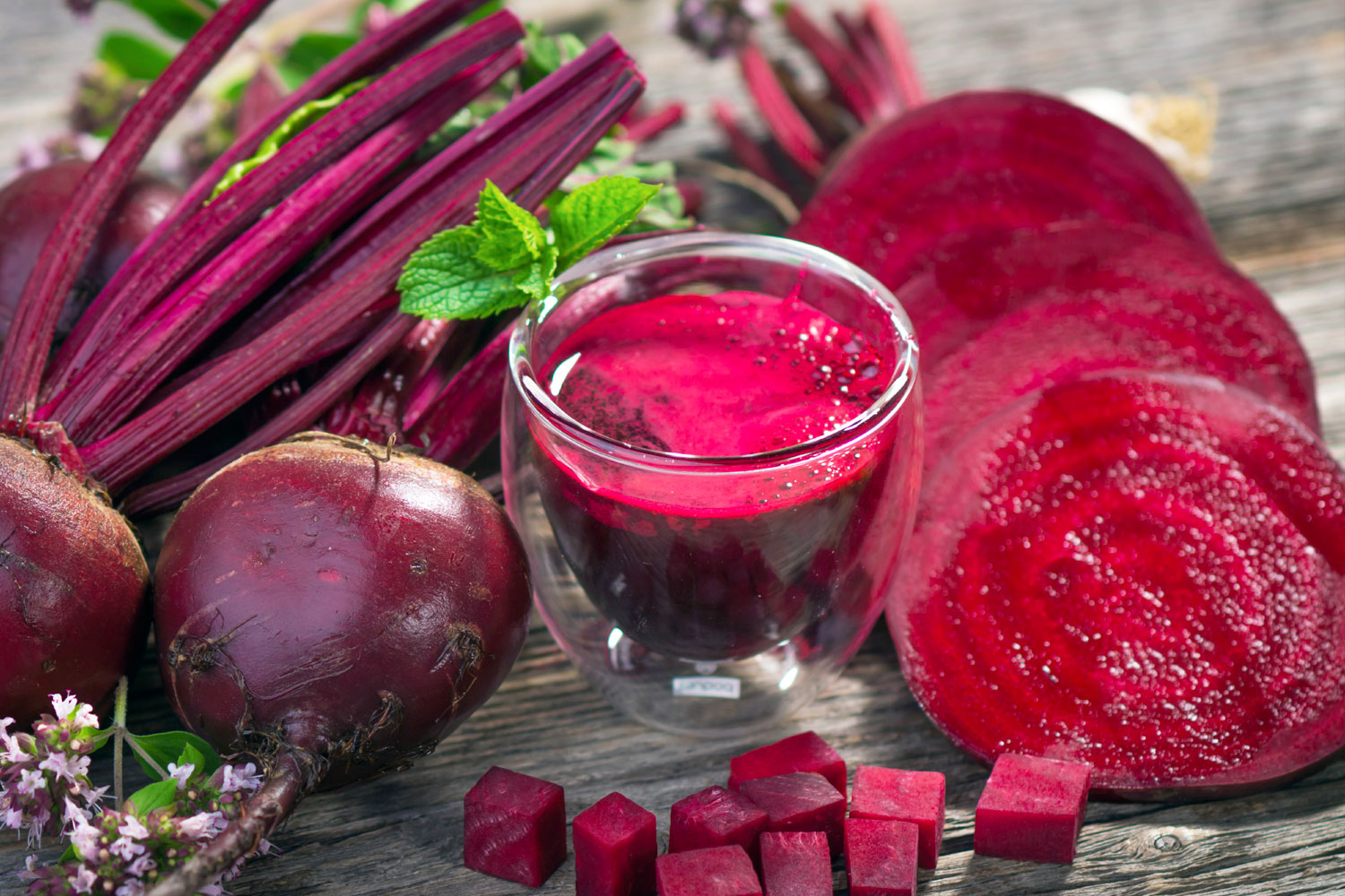 a beet juice detox drink on a wooden table