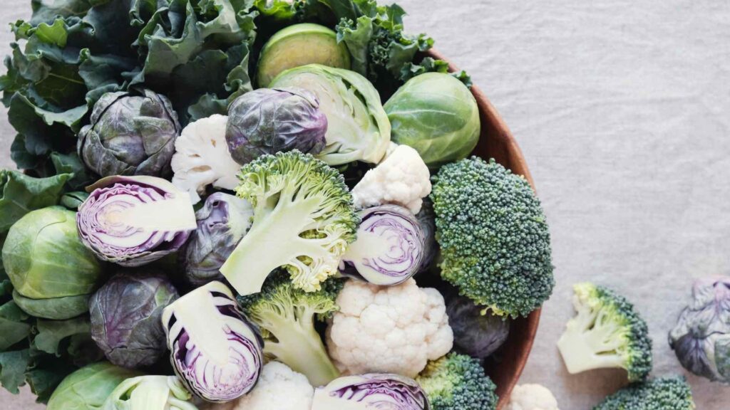 Cruciferous vegetables showing kale, broccoli, cauliflower, and brussels sprouts